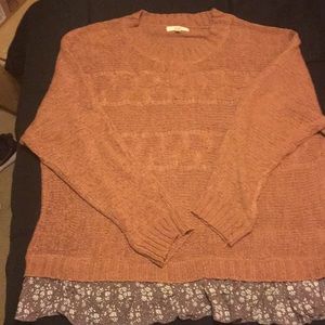 Rust colored sweater with floral ruffle